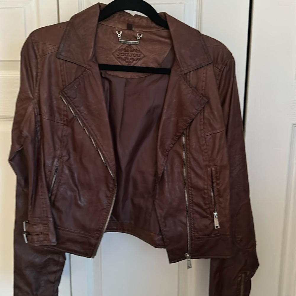 Women’s size medium faux leather crop style jacket.